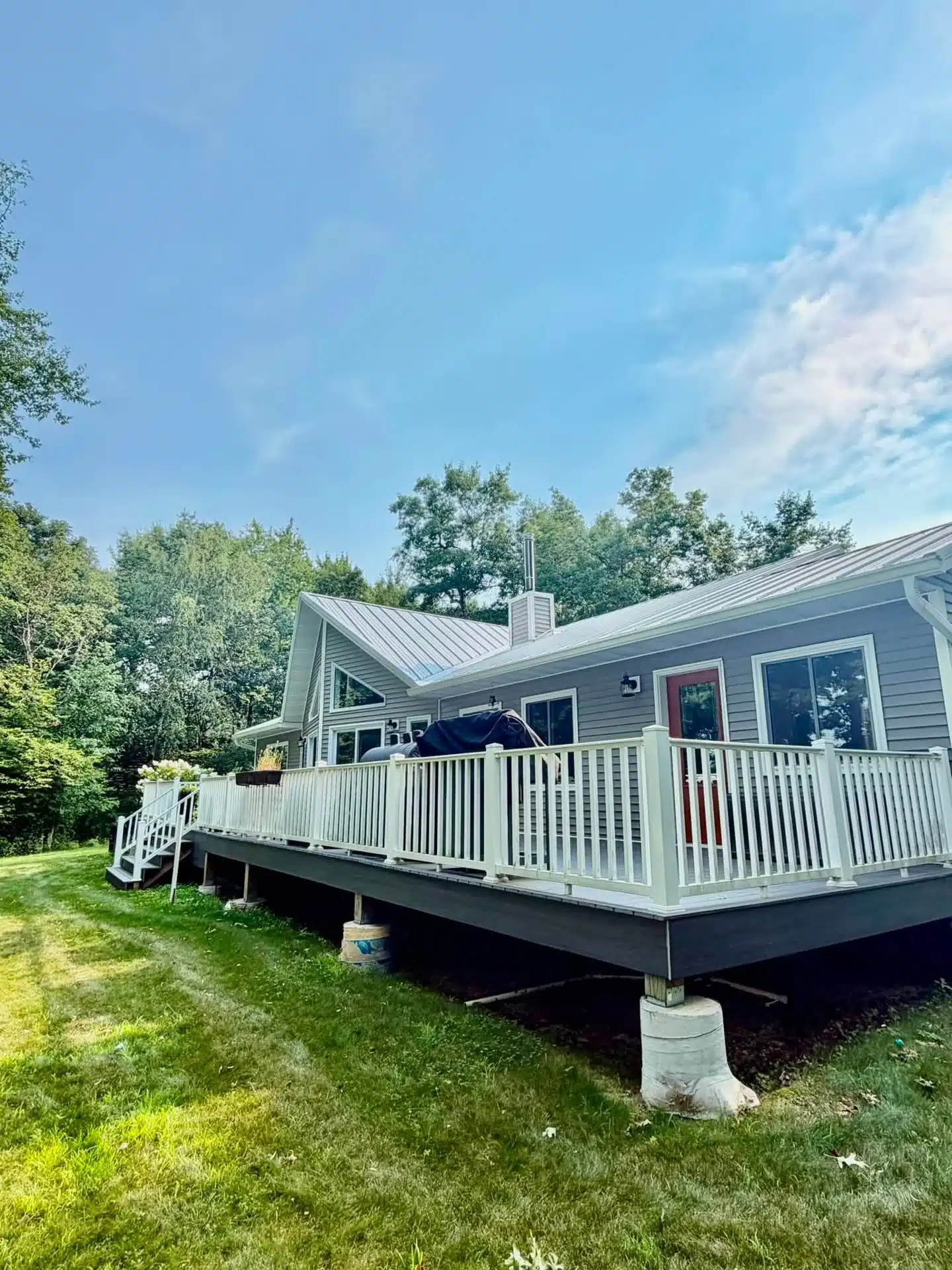 Seamless gutters above raised deck — Built By Betts project photo